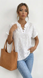 Lina - Blusa con drapado floral